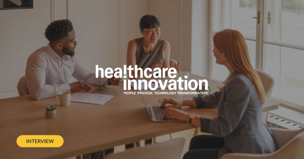 Healthcare Innovation logo overlaid on top of image showing professionals meeting in a business setting