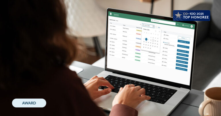 Provider accessing ProsperityEHR platform on laptop with "CO-100 Honoree" badge overlaid