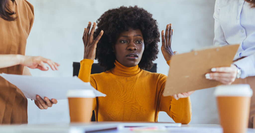 Practice owner reviewing information and thinking about what's involved in switching her practice's behavioral health EHR